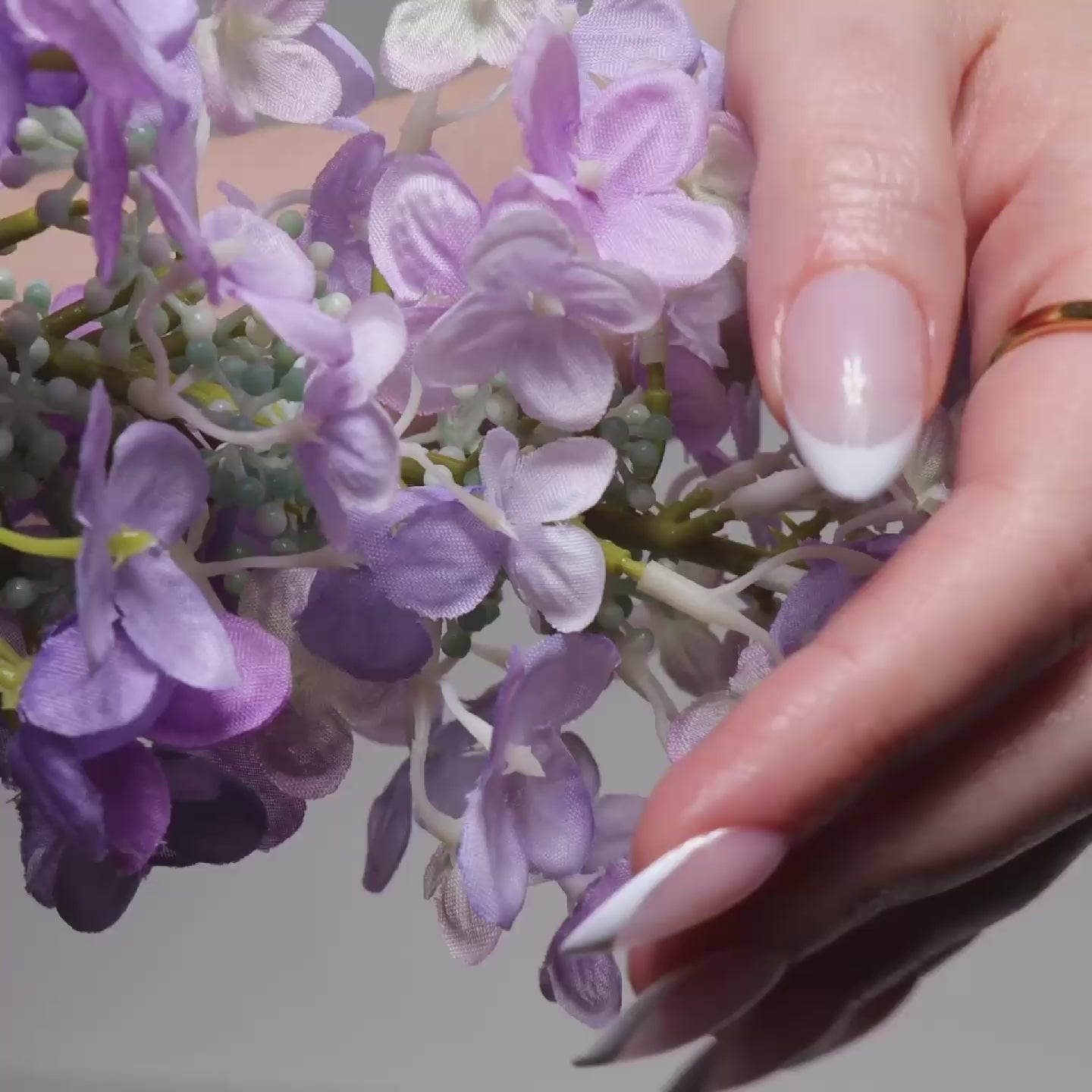 Reusable nail extensions in long almond length French nails. 