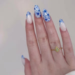 Reusable nail extensions mosaic art in long almond length.