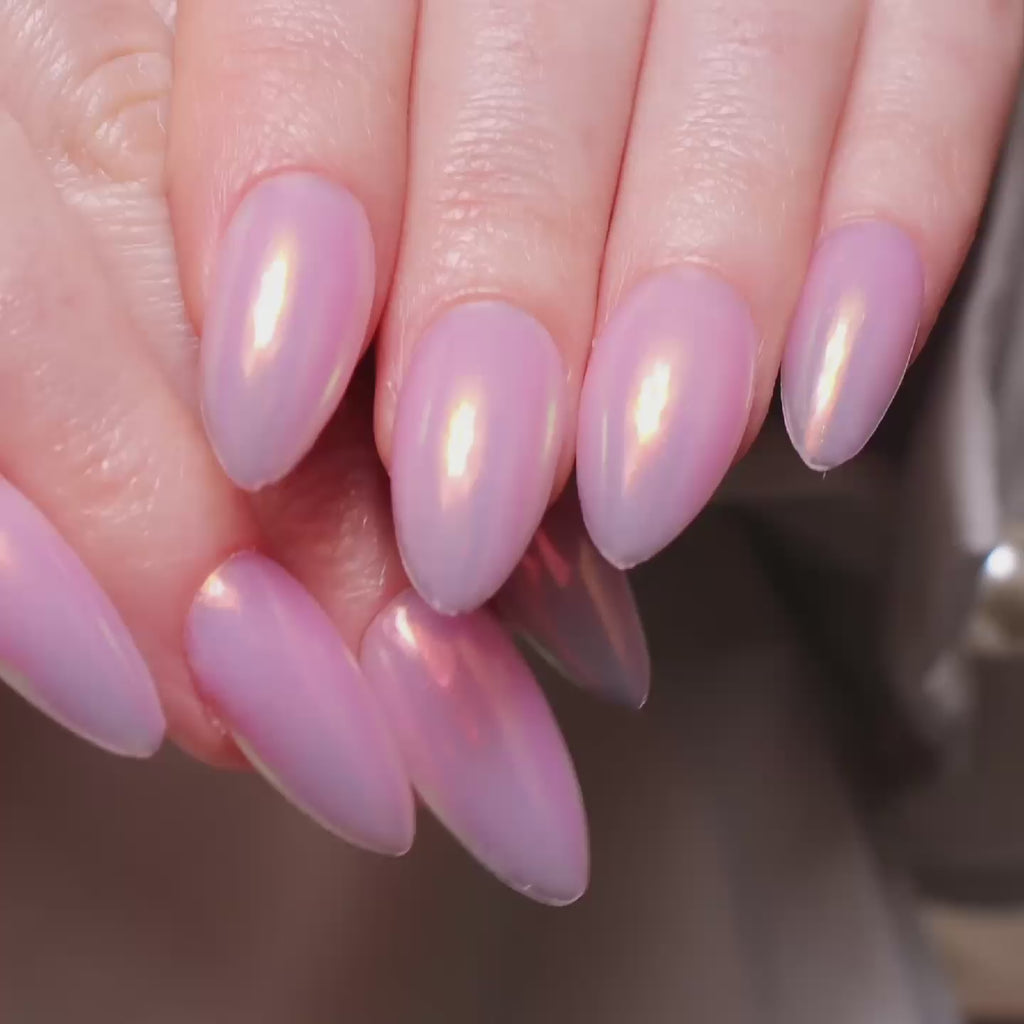 Reusable nail extensions in long almond length chrome nails. 