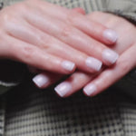 Reusable nail extensions in short square length micro French nails. 