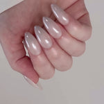 Reusable nail extensions in long almond length chrome nails. 