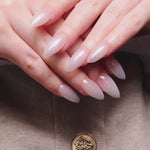 Reusable nail extensions in long almond length chrome nails. 