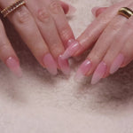 Reusable nail extensions in long almond length.