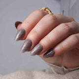 Glitter nails. Encapsulated glitter. Reusable nail extensions. 