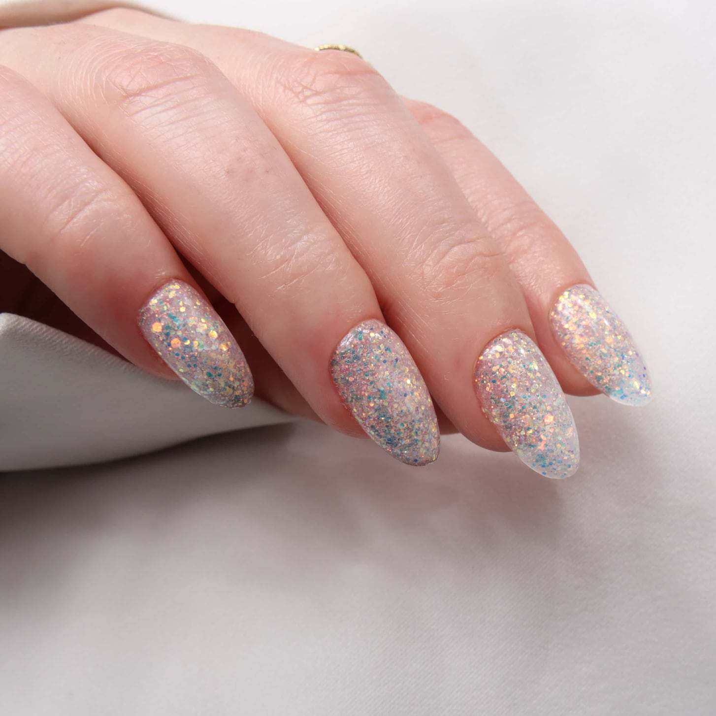Glitter nails. Encapsulated glitter. Reusable nail extensions. 